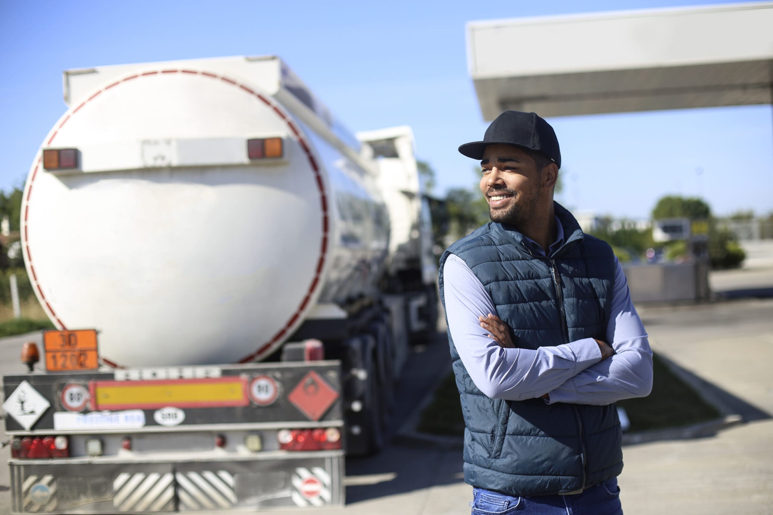 Fuel tanker driver on a gas station.